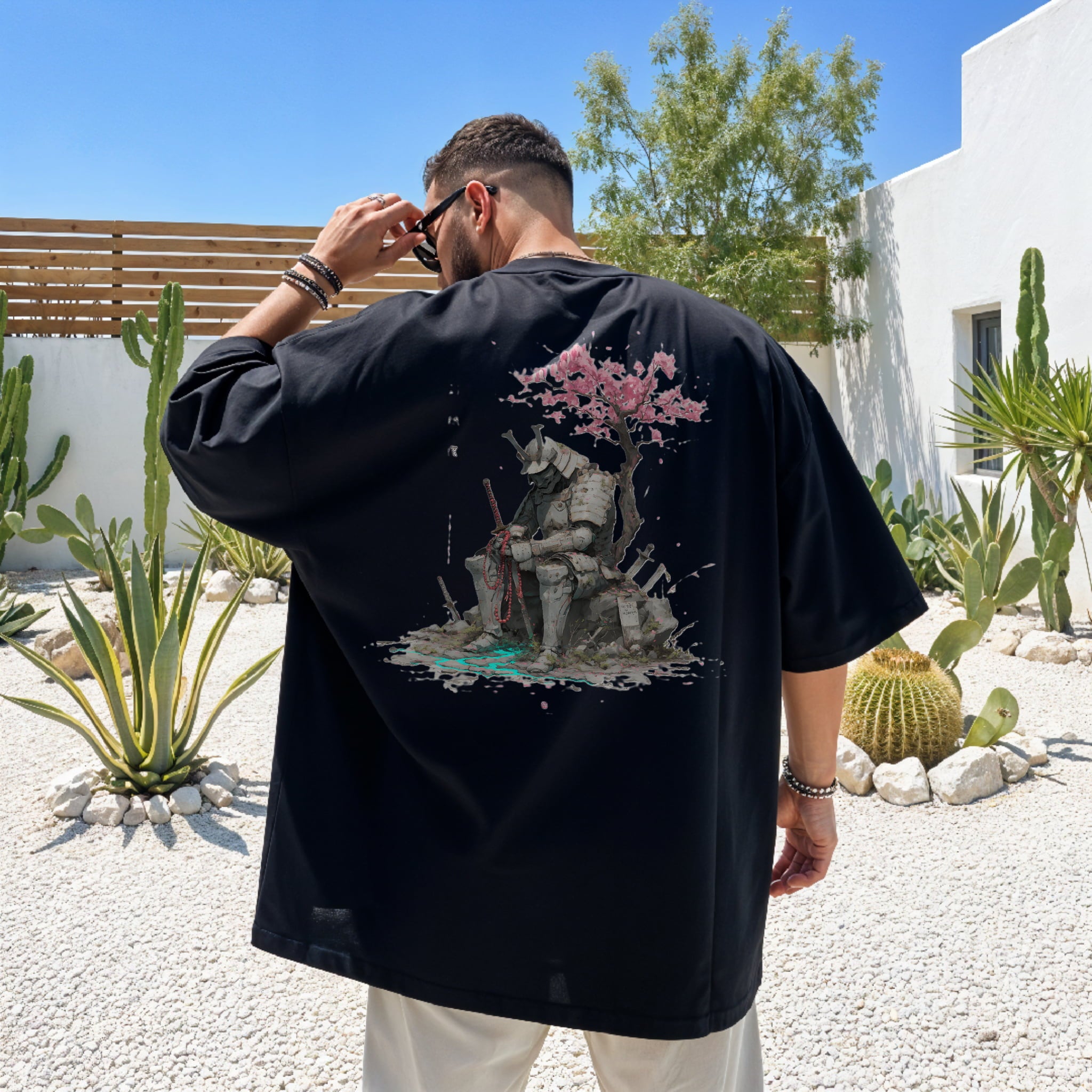 Lifestyle shot wearing The Last Shrinekeeper Japanese shrine art streetwear T-shirt.