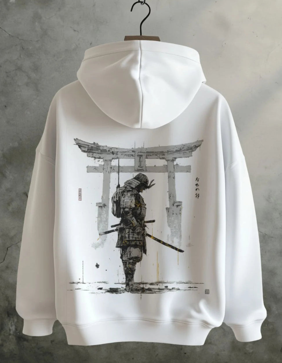 White hoodie with black and white graphic design on a gray background