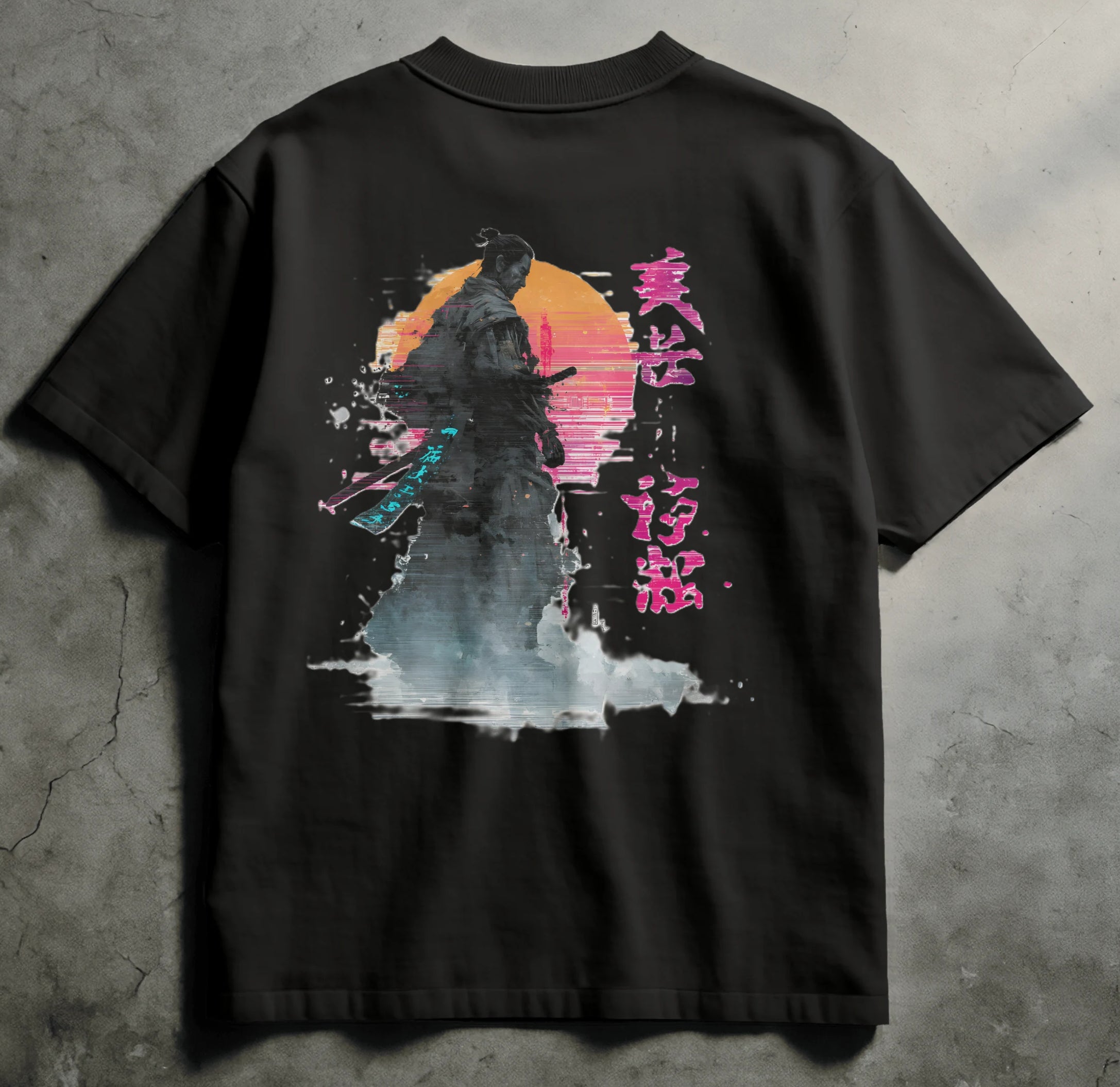 Black t-shirt with a colorful graphic design on a concrete surface